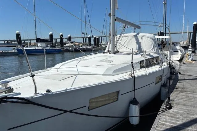 Slide: The Image of 2017 Beneteau Oceanis 41.1 sailboat docked at marina under clear blue sky. - 19
