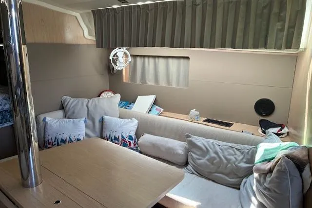Slide: The Image of Interior of 2017 Beneteau Oceanis 41.1 yacht with cozy seating and nautical decor. - 23