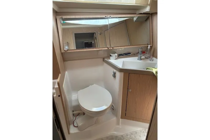 Slide: The Image of Bathroom interior of 2017 Beneteau Oceanis 41.1 yacht, featuring sink and toilet. - 25