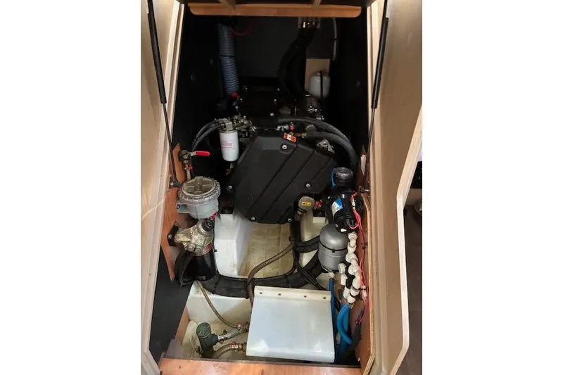 Slide: The Image of Engine compartment of a 2017 Beneteau Oceanis 41.1 sailboat, showcasing mechanical components. - 29