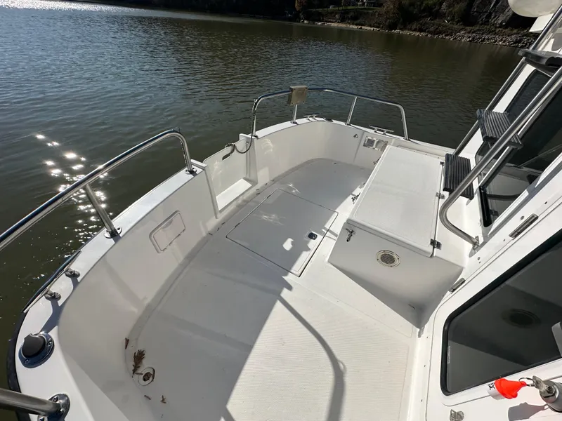 Slide: The Image of 2007 Nordic Tug 32 boat deck with railing, on calm water. - 17