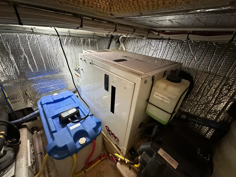 Slide: The Image of Engine room of 2007 Nordic Tug 32 with generator and battery. - 24