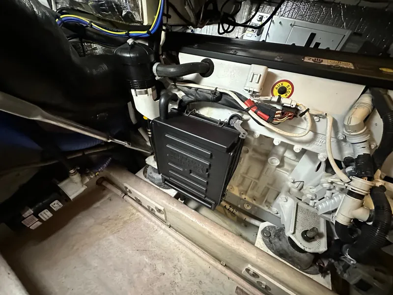 Slide: The Image of Engine compartment of a 2007 Nordic Tug 32, showcasing mechanical components and wiring. - 27