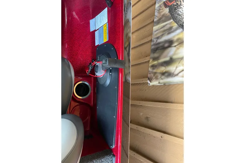 Slide: The Image of Interior of a 2013 Nitro Z-7 boat showing seating and control panel. - 11