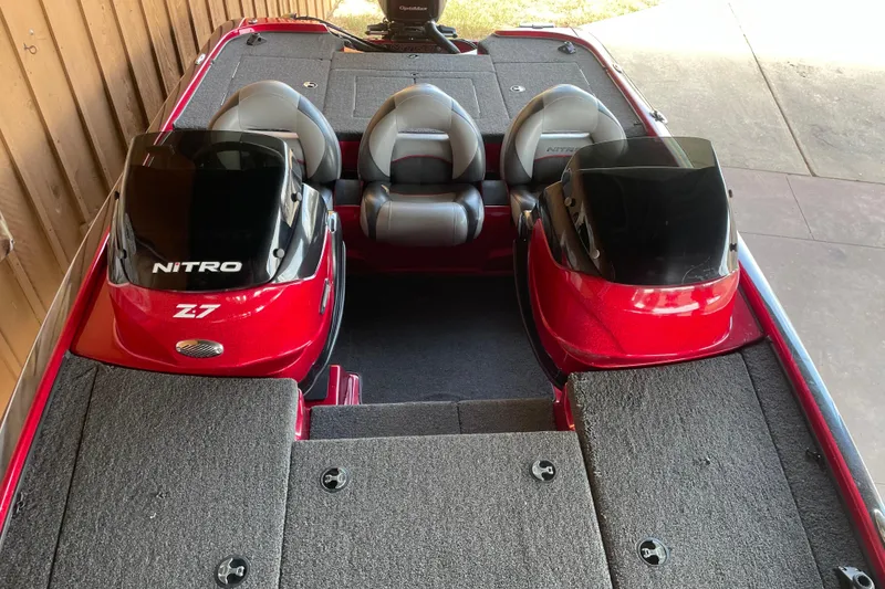 Slide: The Image of Red 2013 Nitro Z-7 boat interior with dual consoles and seating. - 12