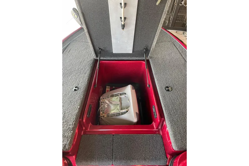 Slide: The Image of Open storage compartment in a 2013 Nitro Z-7 boat with equipment inside. - 3
