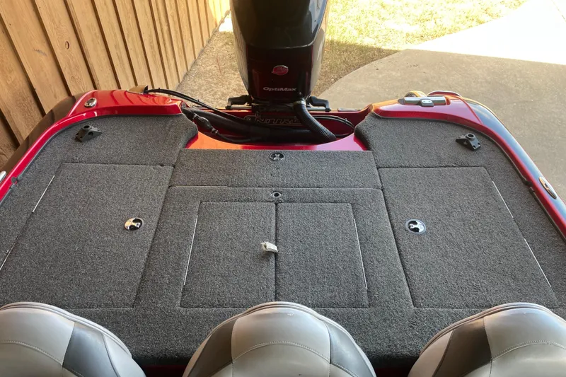 Slide: The Image of 2013 Nitro Z-7 boat deck with carpeted storage compartments and motor. - 4