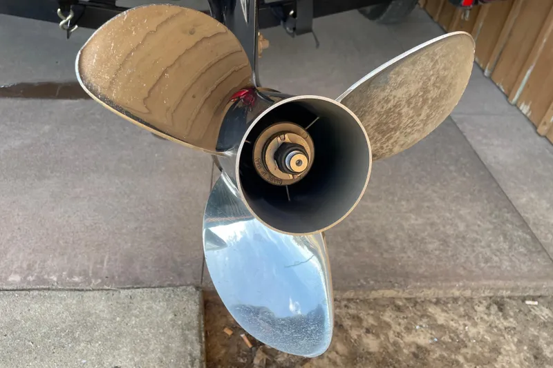 Slide: The Image of Close-up of a 2013 Nitro Z-7 boat propeller on a concrete surface. - 5
