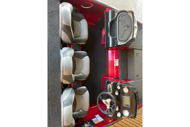 Slide: The Image of 2013 Nitro Z-7 boat interior with steering wheel and seating arrangement. - 9