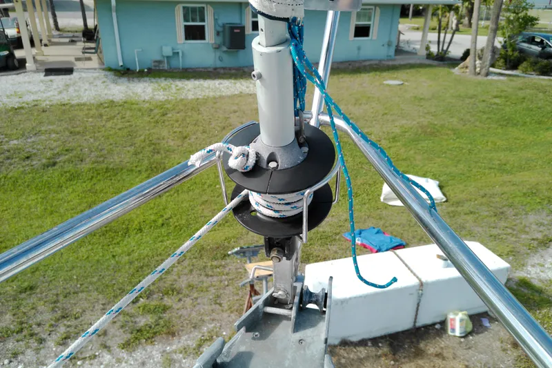 Slide: The Image of Close-up of a Beneteau First 310 sailboat rigging system, showcasing ropes and pulleys. - 10