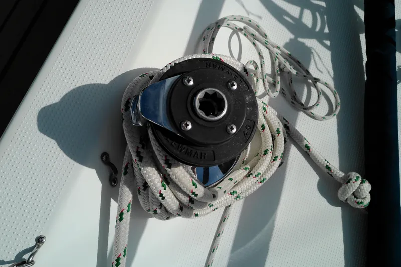 Slide: The Image of Winch and rope on 1993 Beneteau First 310 sailboat deck. - 15