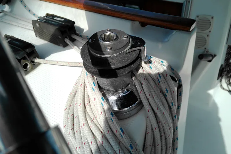 Slide: The Image of Winch and ropes on a 1993 Beneteau First 310 sailboat deck. - 16