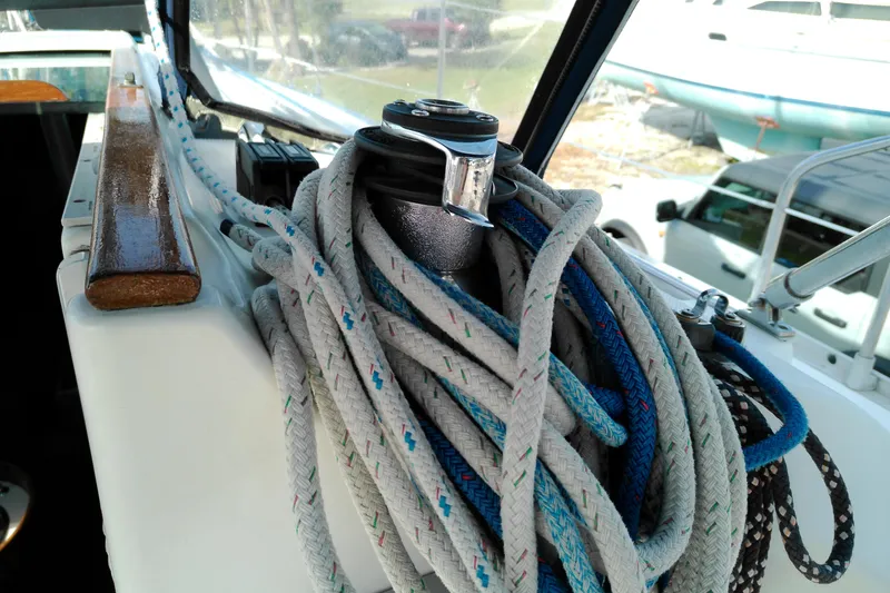 Slide: The Image of Coiled ropes on a 1993 Beneteau First 310 sailboat deck. - 18