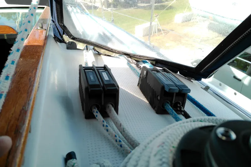 Slide: The Image of Deck view of a 1993 Beneteau First 310 sailboat with rope clutches. - 21