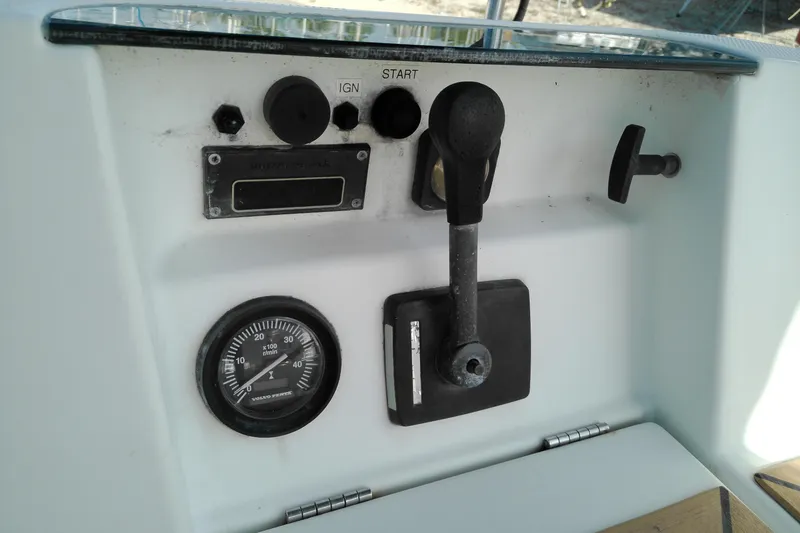 Slide: The Image of Control panel of a 1993 Beneteau First 310 sailboat with throttle and gauge. - 22