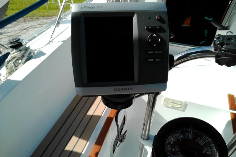 Slide: The Image of Garmin GPS device on 1993 Beneteau First 310 sailboat cockpit. - 24