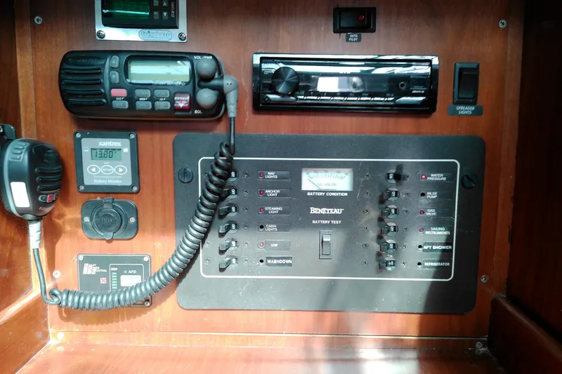 Slide: The Image of Control panel of a 1993 Beneteau First 310 sailboat with radio and battery monitor. - 31