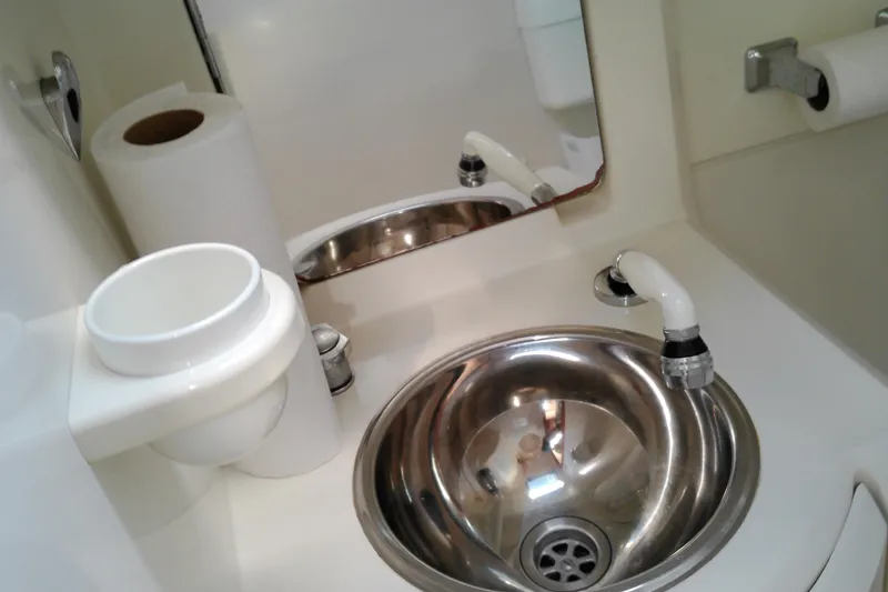 Slide: The Image of Compact bathroom sink in a 1993 Beneteau First 310 yacht, featuring stainless steel basin. - 33