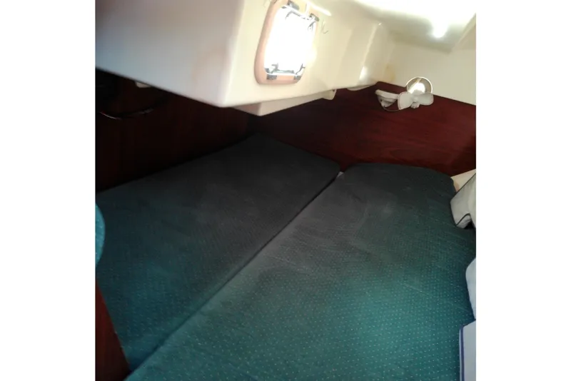 Slide: The Image of Interior cabin of 1993 Beneteau First 310 sailboat with cozy sleeping area. - 34