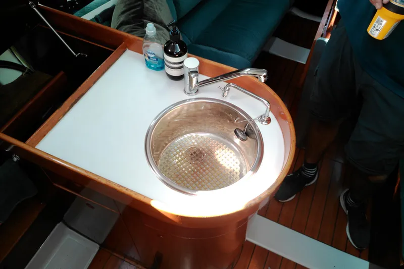 Slide: The Image of Interior of 1993 Beneteau First 310 sailboat showing sink and countertop area. - 39