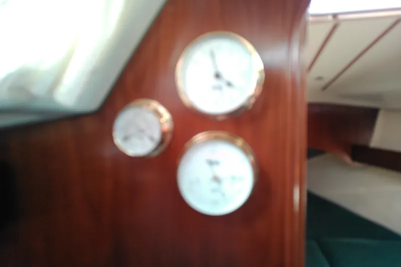 Slide: The Image of Engine compartment of a 1993 Beneteau First 310 sailboat, showcasing mechanical components. - 43