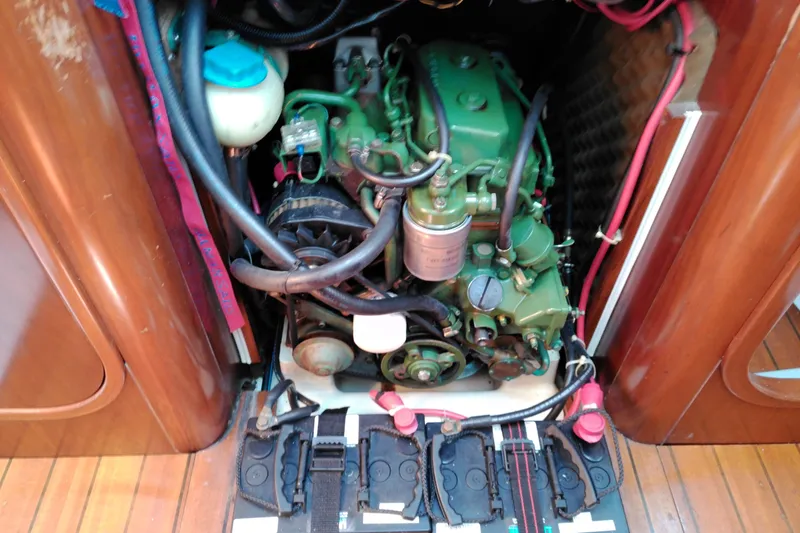 Slide: The Image of Battery setup in a 1993 Beneteau First 310 sailboat engine compartment. - 44