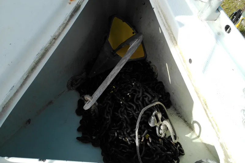 Slide: The Image of Anchor chain storage in a 1993 Beneteau First 310 sailboat compartment. - 9
