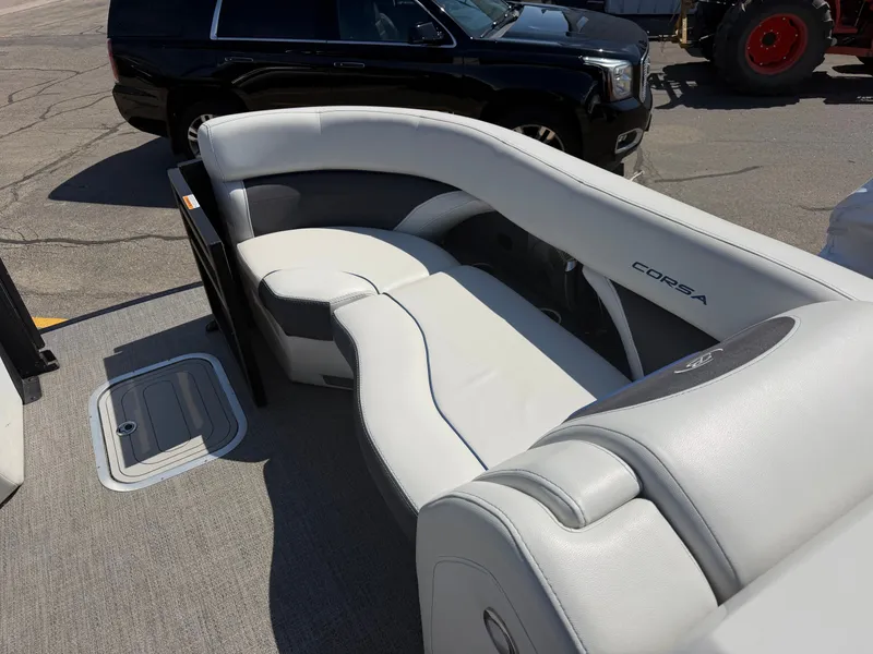 Slide: The Image of Interior of 2022 Barletta CORSA 22 QC TRITOON with luxurious seating. - 12