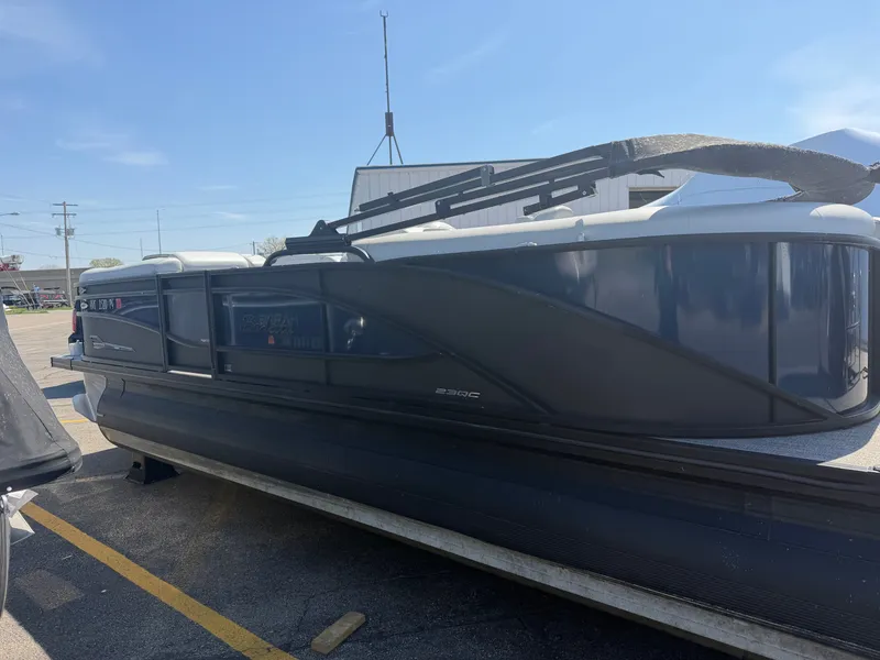 Slide: The Image of 2022 Barletta CORSA 22 QC TRITOON parked outdoors. - 3