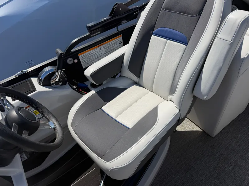 Slide: The Image of Barletta CORSA 22 QC TRITOON 2022, luxurious captain's chair and helm console. - 6