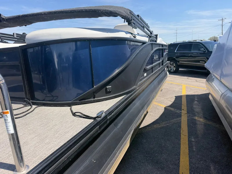 Slide: The Image of 2022 Barletta CORSA 22 QC TRITOON boat in parking lot. - 7