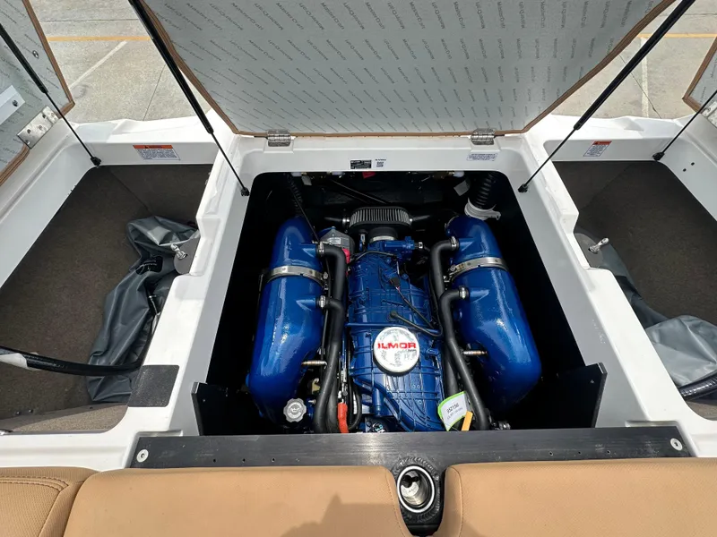 Slide: The Image of 2021 MasterCraft XT25 boat engine compartment with open hatch. - 20