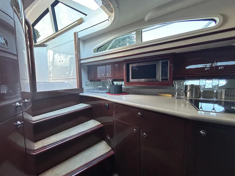 Slide: The Image of Interior of 2006 Neptunus 55 Cabrio yacht with modern kitchen and stairs. - 13