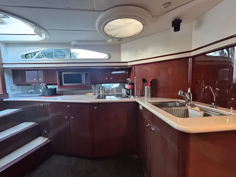Slide: The Image of Luxurious kitchen interior of 2006 Neptunus 55 Cabrio yacht with modern amenities. - 14