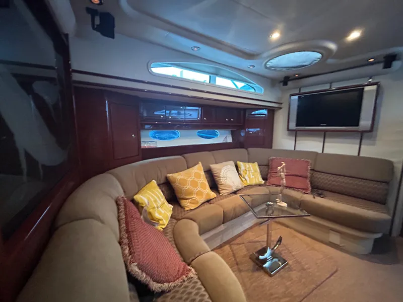 Slide: The Image of Luxurious interior of 2006 Neptunus 55 Cabrio yacht with plush seating and modern decor. - 16