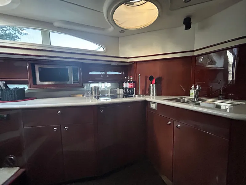 Slide: The Image of Luxurious kitchen interior of 2006 Neptunus 55 Cabrio yacht with modern amenities. - 17
