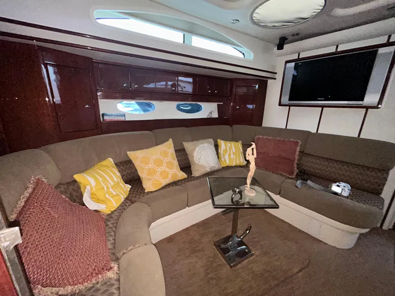Slide: The Image of Luxurious interior of 2006 Neptunus 55 Cabrio yacht with plush seating and modern decor. - 18