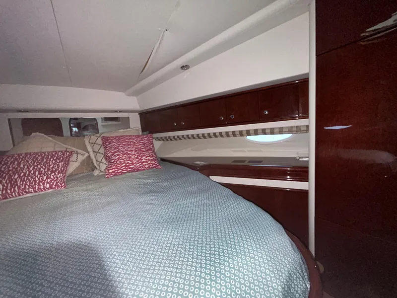 Slide: The Image of Interior cabin of 2006 Neptunus 55 Cabrio yacht with bed and wooden cabinetry. - 20
