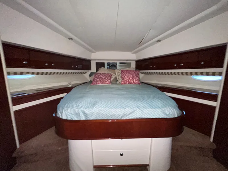 Slide: The Image of Luxurious cabin interior of a 2006 Neptunus 55 Cabrio yacht with elegant bedding. - 23