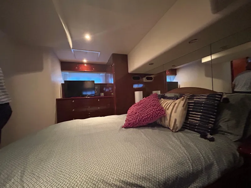 Slide: The Image of Luxurious bedroom interior of 2006 Neptunus 55 Cabrio yacht with modern decor and TV. - 26