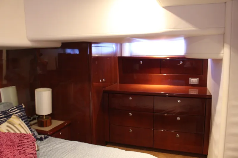 Slide: The Image of Luxurious cabin interior of 2006 Neptunus 55 Cabrio yacht with polished wood finish. - 27