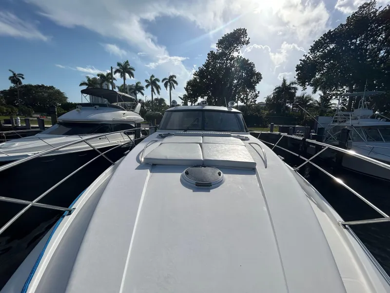 Slide: The Image of Front view of a 2006 Neptunus 55 Cabrio yacht docked under a sunny sky. - 29