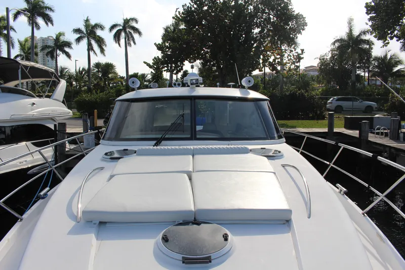 Slide: The Image of 2006 Neptunus 55 Cabrio yacht docked, featuring sleek design and spacious deck. - 30