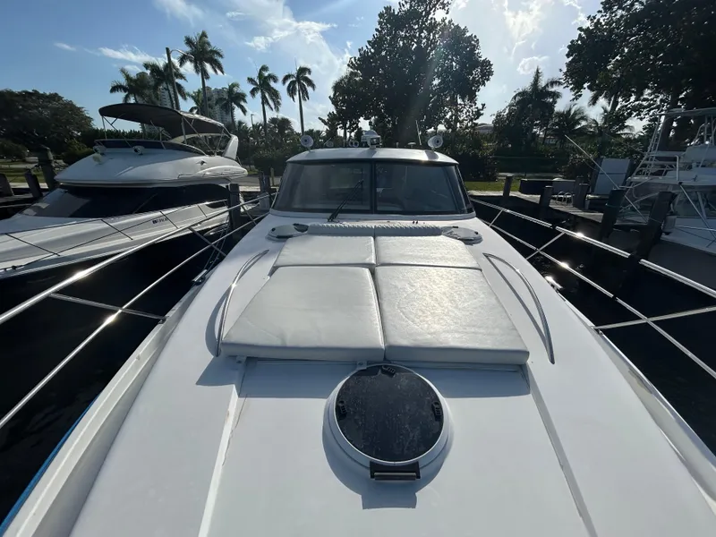 Slide: The Image of 2006 Neptunus 55 Cabrio yacht docked, featuring sleek design and spacious deck. - 31