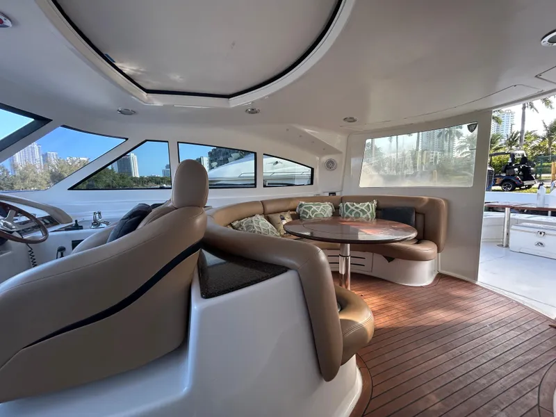 Slide: The Image of Luxurious interior of 2006 Neptunus 55 Cabrio yacht with plush seating and wooden flooring. - 6