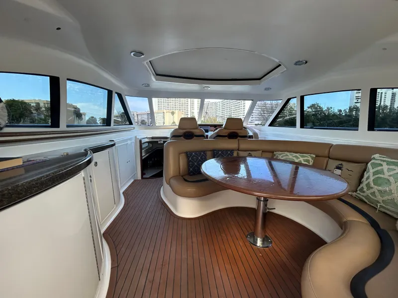 Slide: The Image of Interior of 2006 Neptunus 55 Cabrio yacht with elegant seating and wooden flooring. - 7