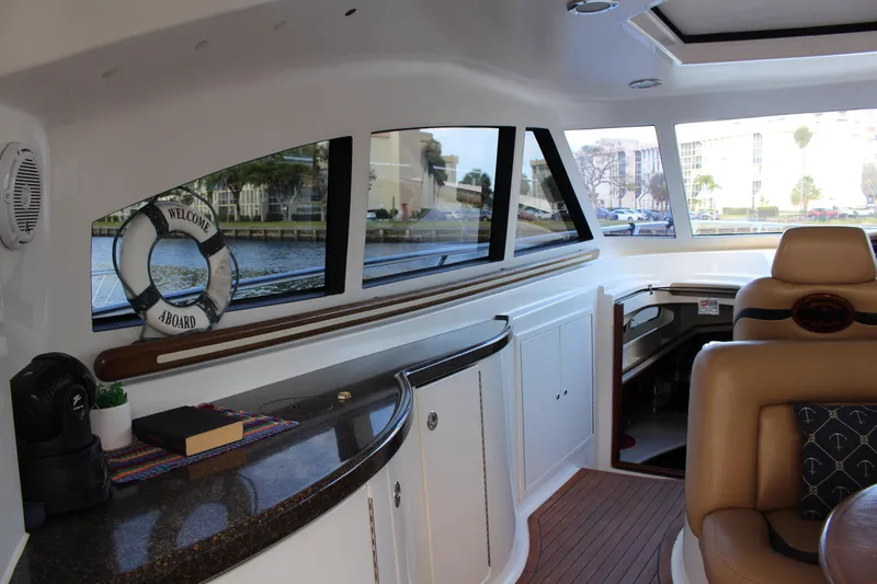 Slide: The Image of Interior of 2006 Neptunus 55 Cabrio yacht with luxurious seating and sleek design. - 9