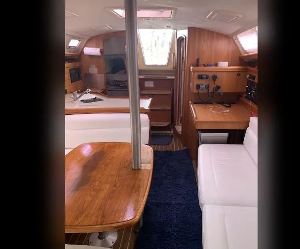Slide: The Image of Interior of a 2005 Hunter Mariner 36 yacht with wooden furnishings. - 2