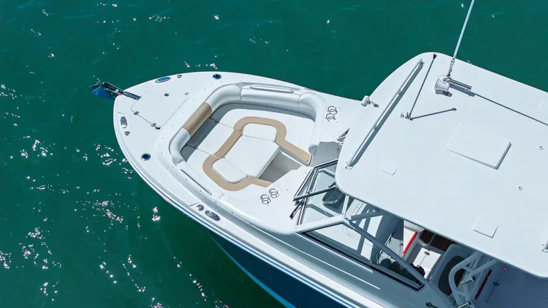 Slide: The Image of Aerial view of Edgewater 280CX Crossover yacht on blue water. - 1