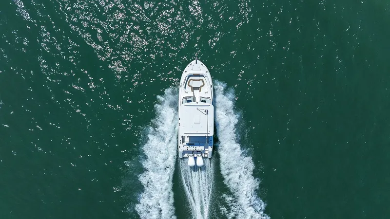 Slide: The Image of Aerial view of Edgewater 280CX Crossover boat on water. - 16